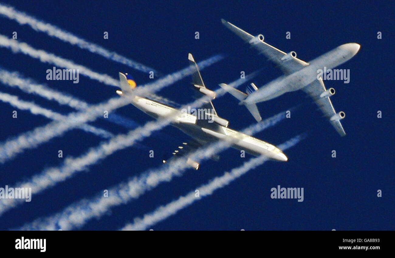 Re-crop of previously transmitted image. Airliners belonging to Air France and Lufthansa appear to have a near miss over London, England. Stock Photo