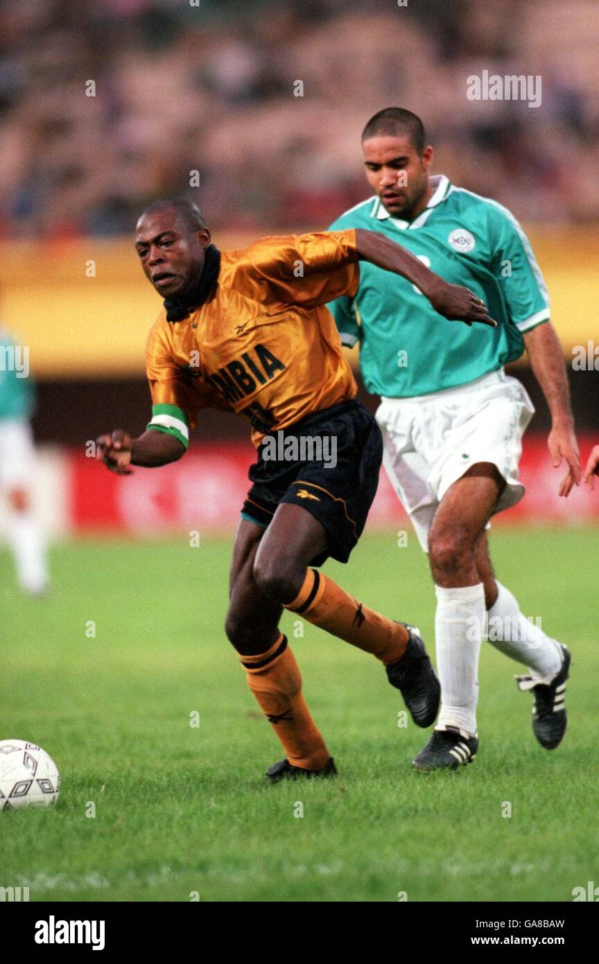 Soccer - African Nations Cup - Burkina Faso - Group D - Zambia v Egypt. Zambia's Kalusha Bwalya (l) is tracked by Egypt's Medhat Abdelhady (r) Stock Photo