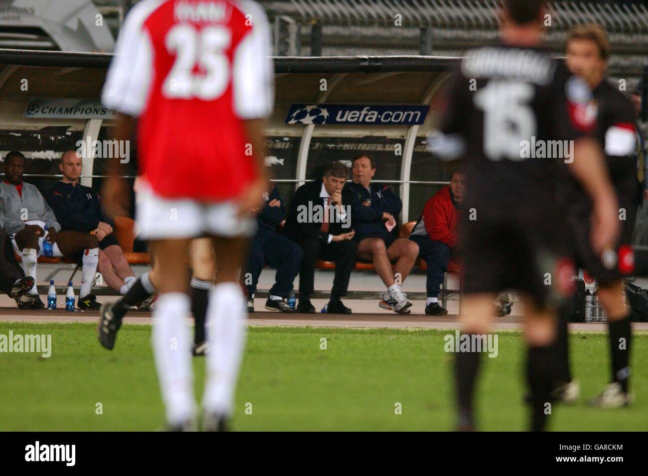 Arsenal manager Arsene Wenger sits dejected on the bench as his team are knocked out of the UEFA Champions League Stock Photo