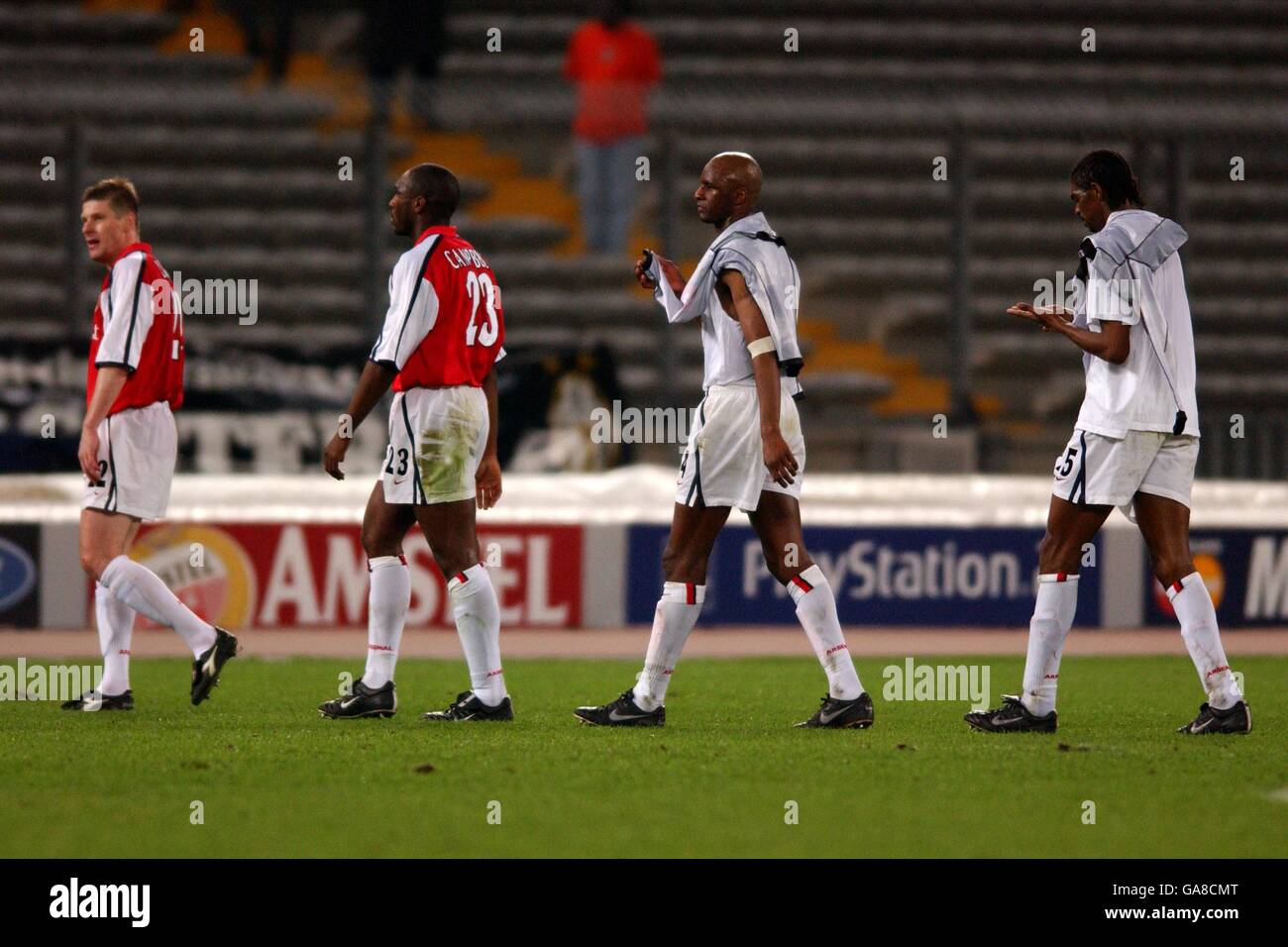 Arsenal's Oleg Luzhny, Sol Campbell, Patrick Vieira and Kanu walk off the pitch at the end of the game as they get knocked out of the UEFA Champions League Stock Photo