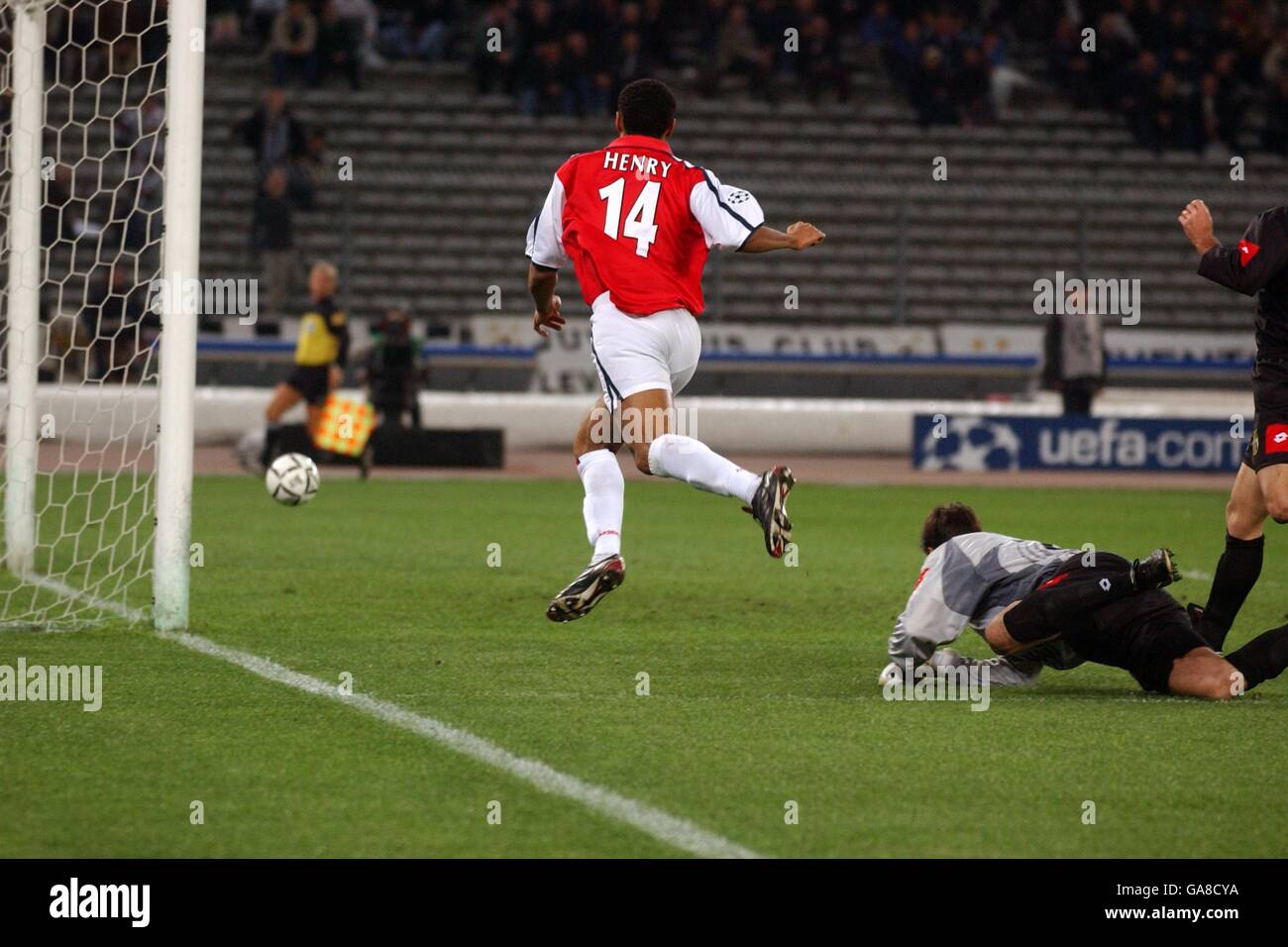 Thierry Henry the Arsenal striker puts the ball wide after getting past Juventus goalkeeper Fabian Carini Stock Photo