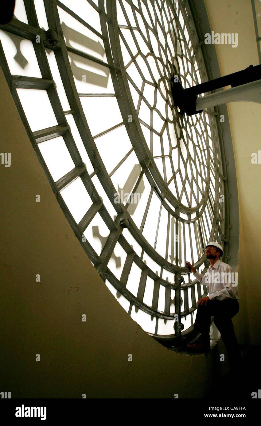 Mike McCann, the keeper of the Great Clock, stands in front of one of the clock faces. The landmark which houses Big Ben is undergoing repairs. Stock Photo