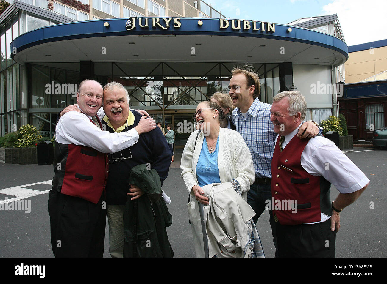 Jurys Hotel staff members Paul Doogan, left , and David Doyle, right, say farewell to regular guests the Limburg family, from the Netherlands, from second left, Koos Limburg, wife Carina, Josephine and Koos Jnr, as Landmark Hotels Jury's Hotel Ballsbridge and The Berkely Hotel Ballsbridge close their doors for business. Stock Photo