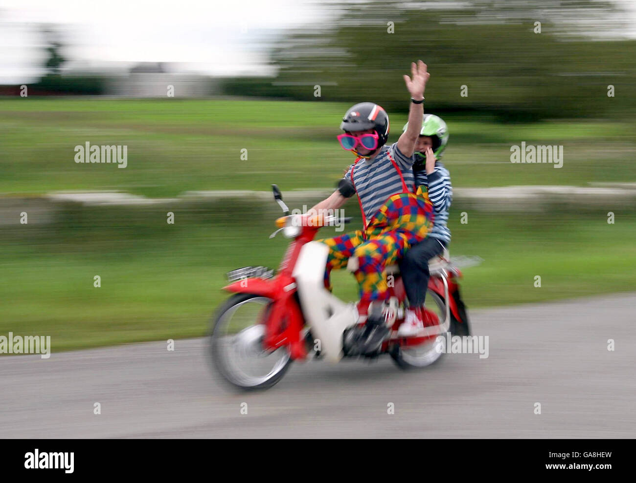 Owners of Honda stepthru 50, 70 and 90cc mopeds take part in a world