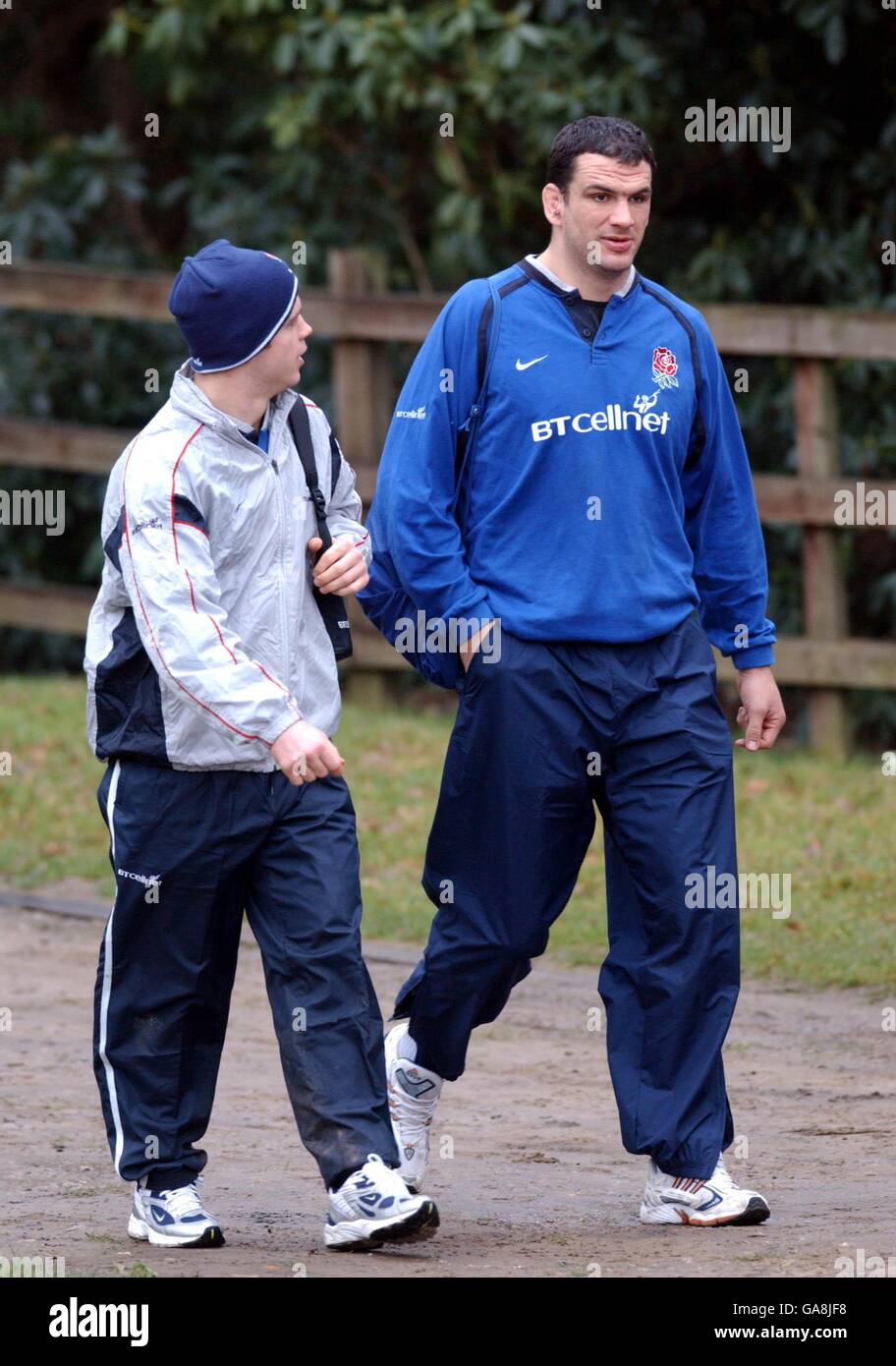 England's captain Martin Johnson talks to Kyran Bracken on the way to