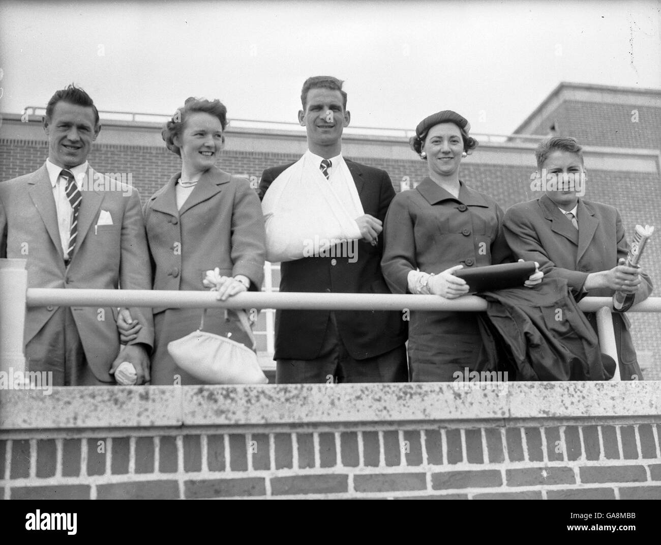 Jack Burkitt, captain of cup-winning Nottingham Forest, has his arm in a sling after getting injured during the cup final. Pictured with him (l-r) Billy Gray, Mrs Gray, Mrs Burkitt and his Roger Burkitt. The Triumphant Nottingham Forest team had a day at the seaside before returning to Nottingham. Stock Photo