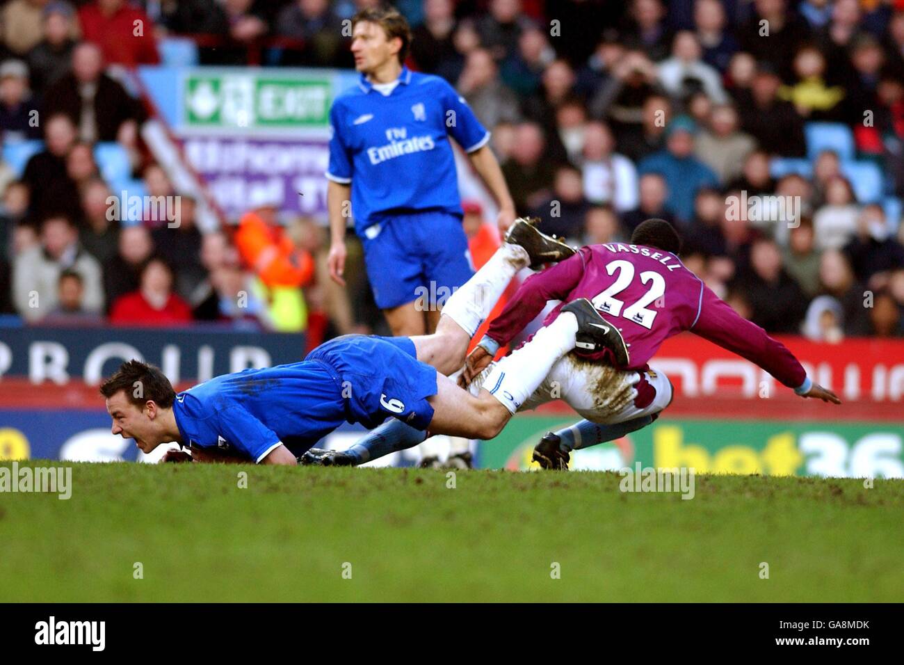 Soccer - FA Barclaycard Premiership - Aston Villa v Chelsea. Aston Villa's Darius Vassell and Chelsea's John Terry clash as they battle for the ball Stock Photo