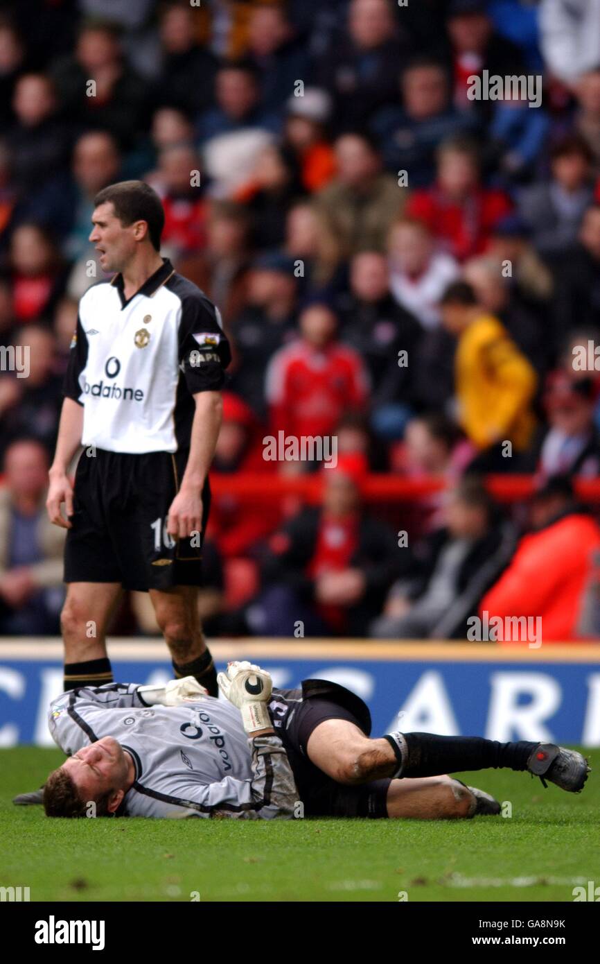 Manchester United's goalkeeper Roy Carroll lies in agony on the floor after taking a knock Stock Photo