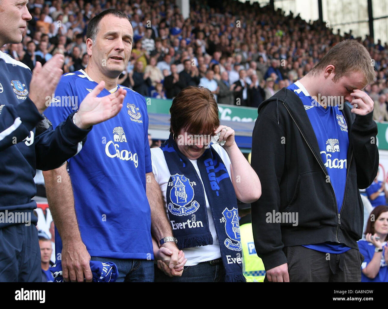 Family of murdered 11 year old Rhys Jones, mother Melanie and father Stephen and brother Owen , at the minute's appreciation before the start of the Premier League match between Everton and Blackburn Rovers at Goodison Park, Liverpool. Stock Photo