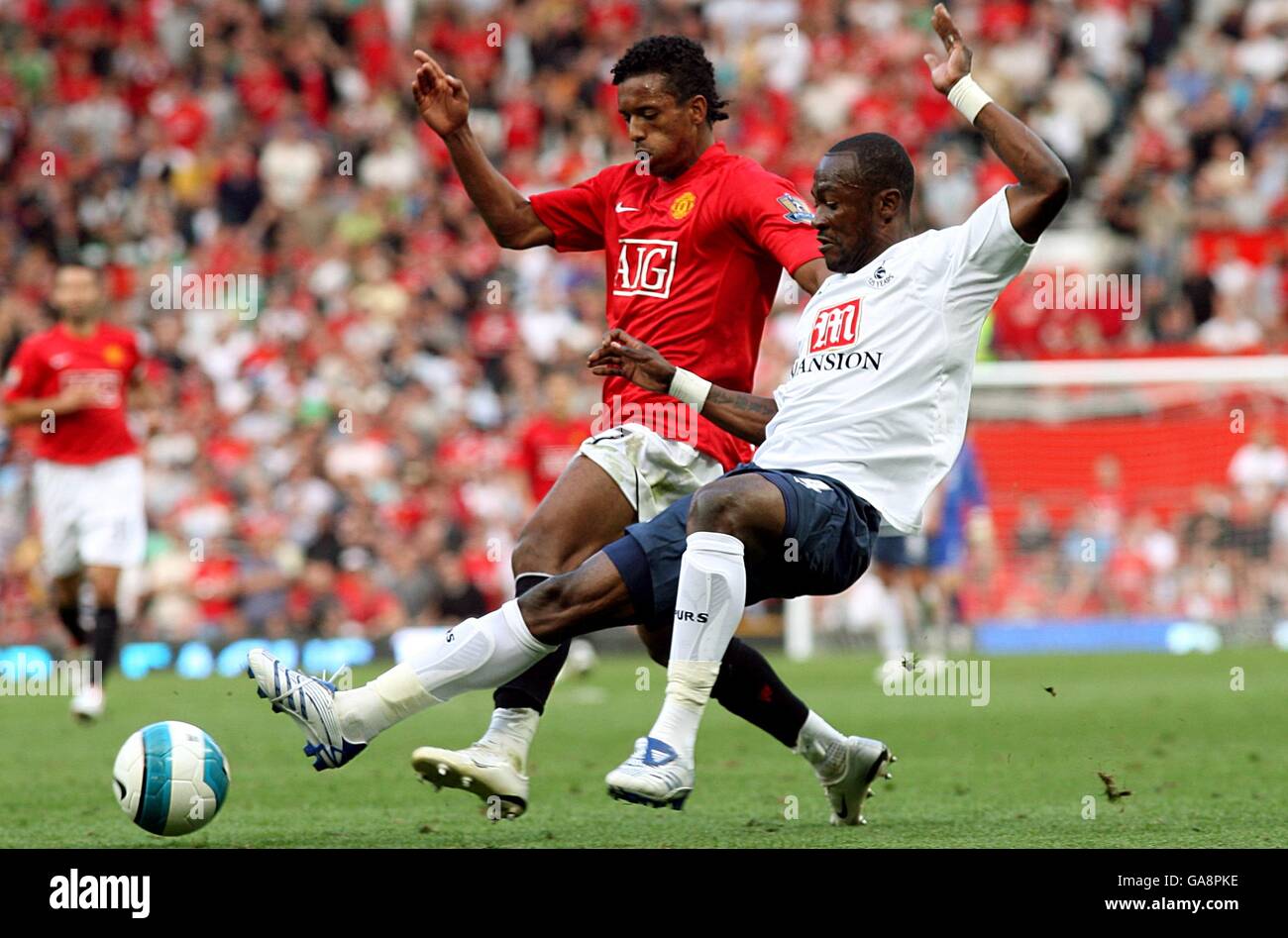 Soccer - Barclays Premier League - Manchester United v Tottenham Hotspur - Old Trafford. Manchester United's Luis Nani (left) and Tottenham Hotspur's Didier Zokora battle for the ball. Stock Photo