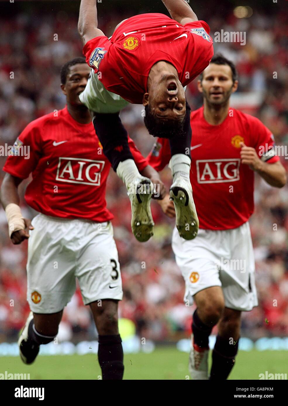 Soccer - Barclays Premier League - Manchester United v Tottenham Hotspur - Manchester. Manchester United's Luis Nani (centre) celebrates in style in front of his team mates after scoring the first goal of the game. Stock Photo