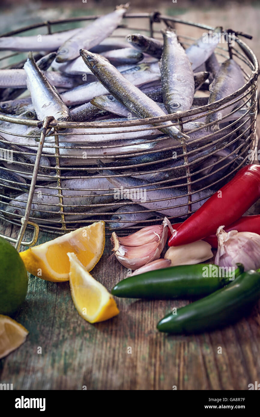 Fresh sardines with garlic, lemon and jalapeno peppers Stock Photo Alamy