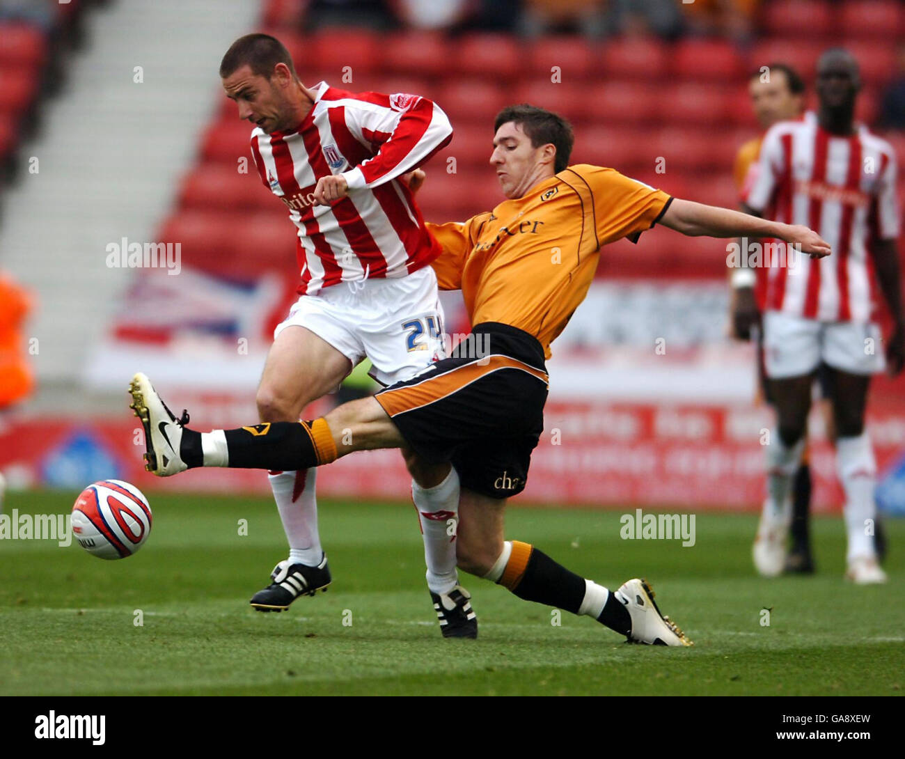 Stoke City's Rory Delap and Wolverhampton Wanderers' Stephen Ward in action during the Coca-Cola Championship match at the Britannia Stadium, Stoke. Stock Photo