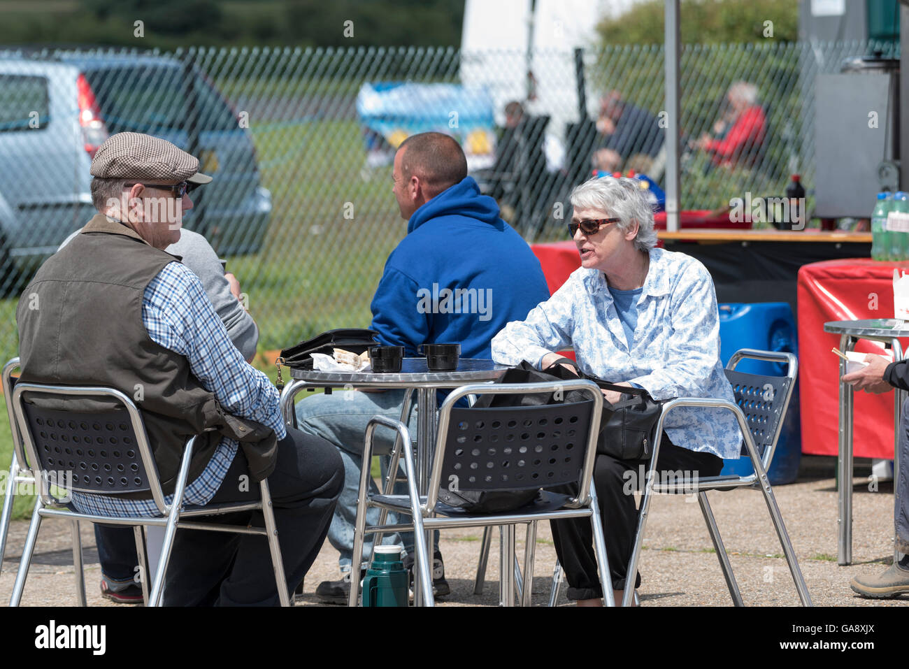 Couple resting at Wings 'n' Wheels North Weald airfield Epping Essex