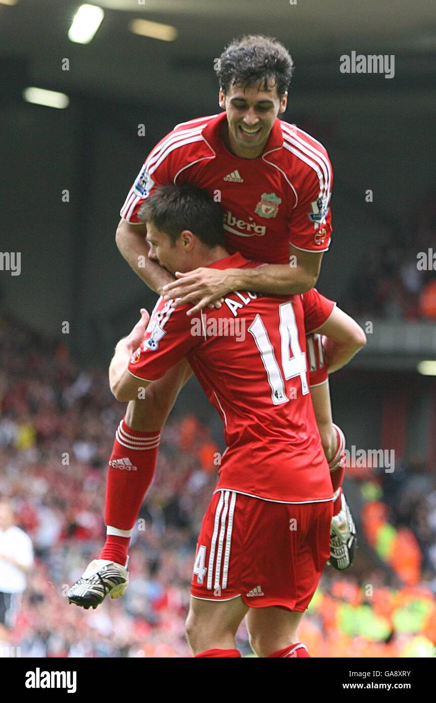 Soccer - Barclays Premier League - Liverpool v Derby County - Anfield. Liverpool's Xabi Alonso is congratulated by Alvaro Arbeloa after scoring the fourth goal Stock Photo