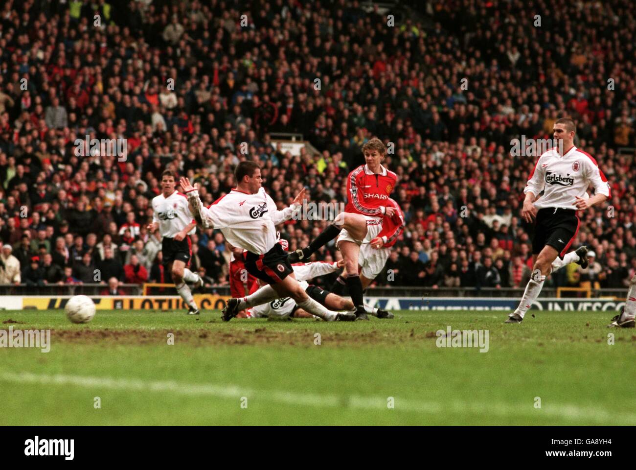 Manchester United's Ole Gunner Solskjaer's (centre) avoids Jamie Carragher to score their winning goal ... Soccer - AXA FA Cup - Fourth Round - Manchester United v Liverpool ... 24-01-1999 ... ... ... Photo Credit should read: Michael Steele/EMPICS Sport/PA Photos. Unique Reference No. 302407 ... Soccer - Euro 2000 Qualifier - Group 5 - England v Bulgaria a dejected Alan Shearer after England could only manage a goalless draw Stock Photo
