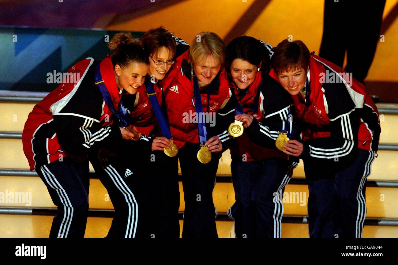 l-r; Great Britain's gold medal winning team of Fiona MacDonald, Janice Rankin, Rhona Martin, Debbie Knox and Margaret Morton celebrate with their medals Stock Photo