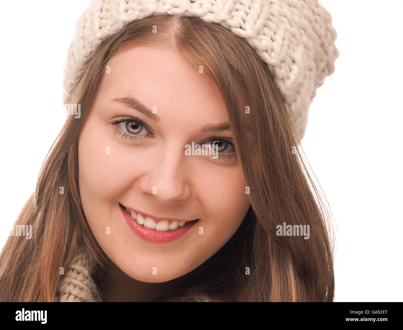 Attractive teenage girl dressed with wool cap and scarf on a white background Stock Photo Alamy