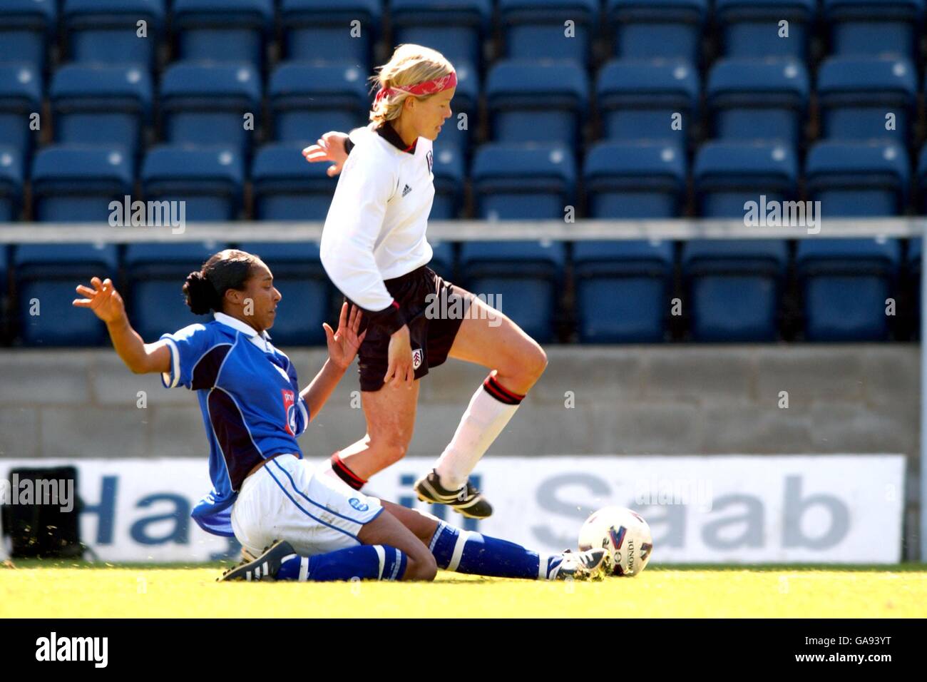 Birmingham City's Stephanie Samuels (l) slides in on Fulham's Marianne Pettersen (r) Stock Photo