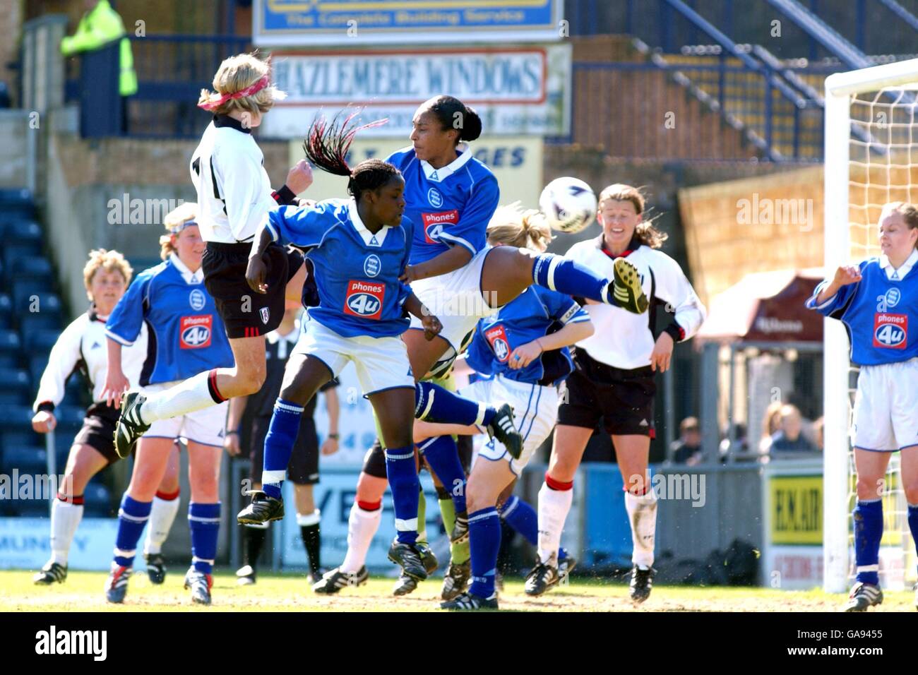 Fulham's Marianne Pettersen (l) jumps for a header with Birmingham City's Faye Cardin (c) and Stephanie Samuels (r) Stock Photo