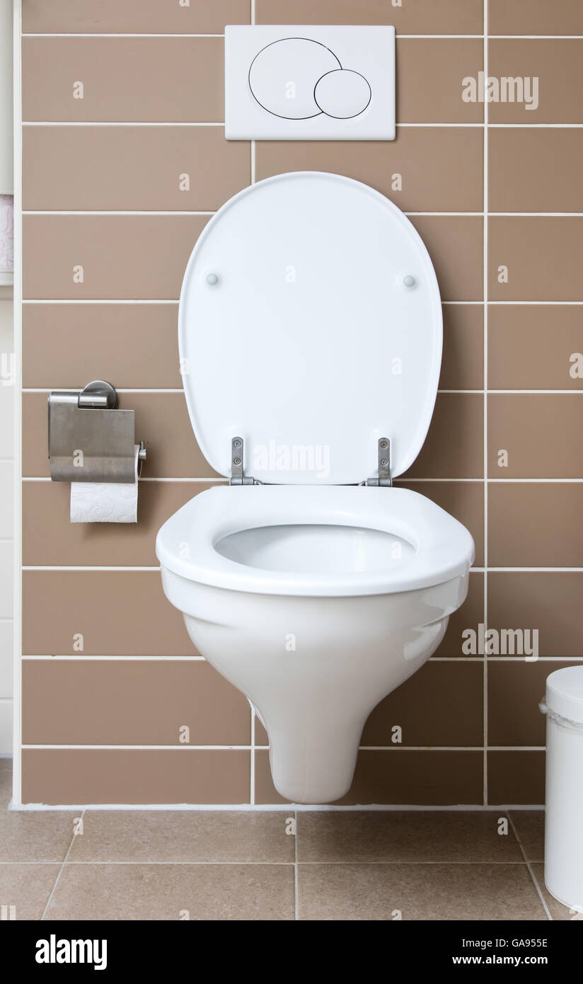 Modern white toilet bowl in the bathroom Stock Photo - Alamy