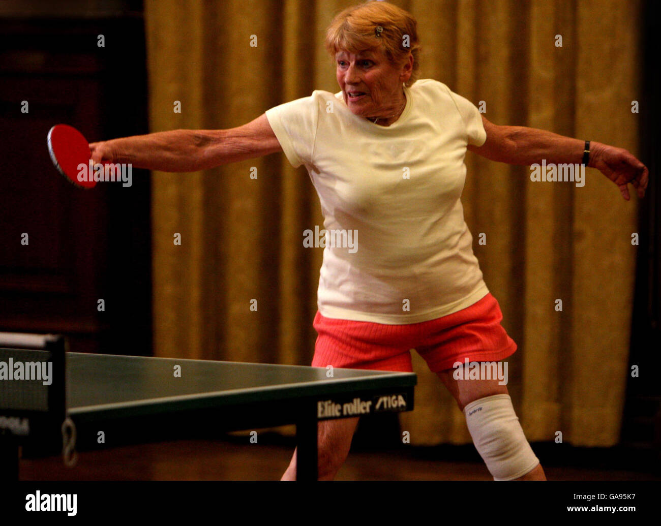 Veteran table tennis champion Edna 81, during a against Japanese Table Tennis prodigy Mima Ito, 6, held at Great Town Hall, Norfolk Stock Photo -