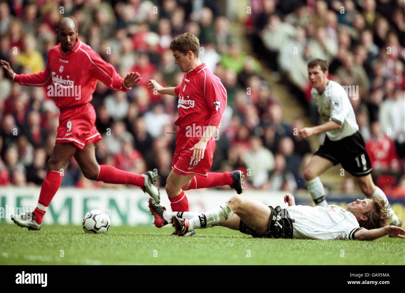 Liverpool's Michael Owen leaves Derby's Warren Barton on his back to score the opening goal of the game Stock Photo