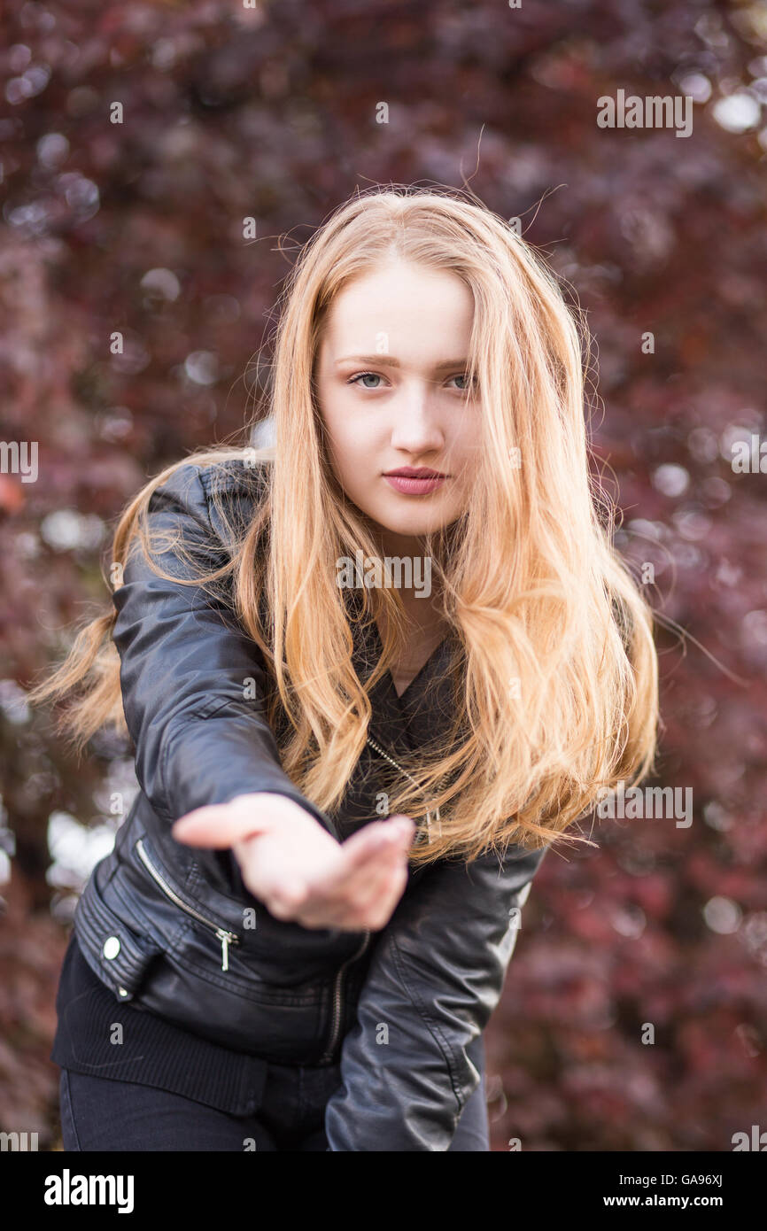 Portrait of girl offering hand Stock Photo