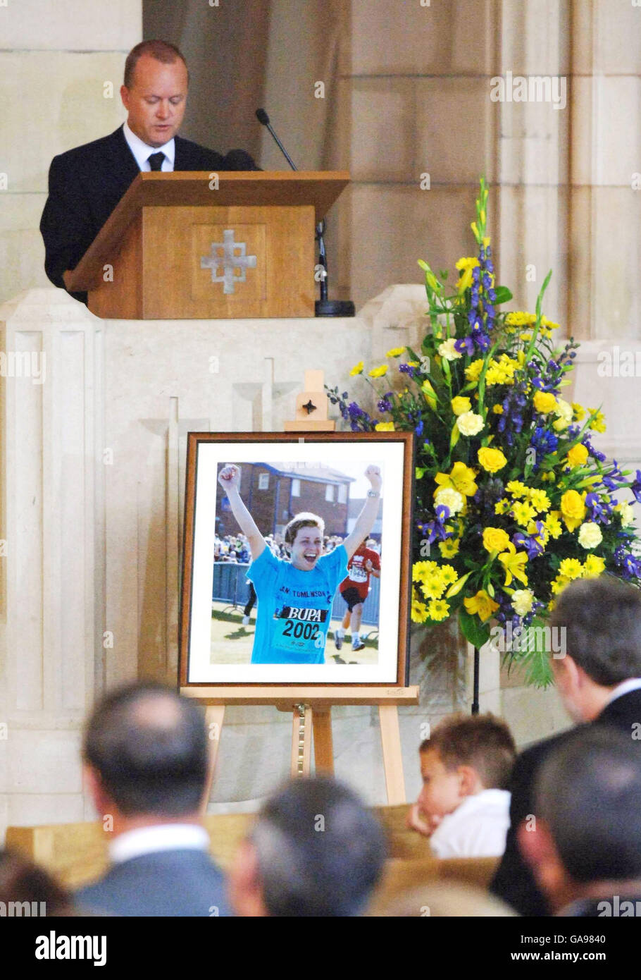 Mike Tomlinson, the husband of charity fundraiser Jane Tomlinson speaks at her funeral St Anne's Cathedral, Leeds. The fundraiser lost her seven-year battle with cancer last week aged 43. Stock Photo
