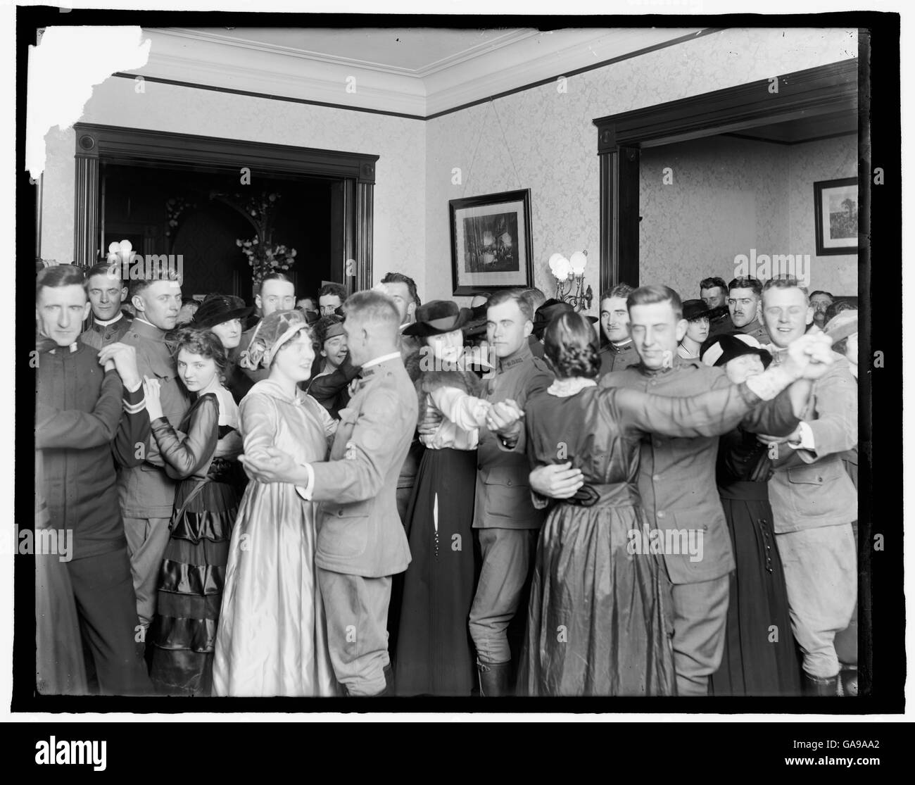 Soldiers and local girls dancing at a World War I Service Club. Stock Photo