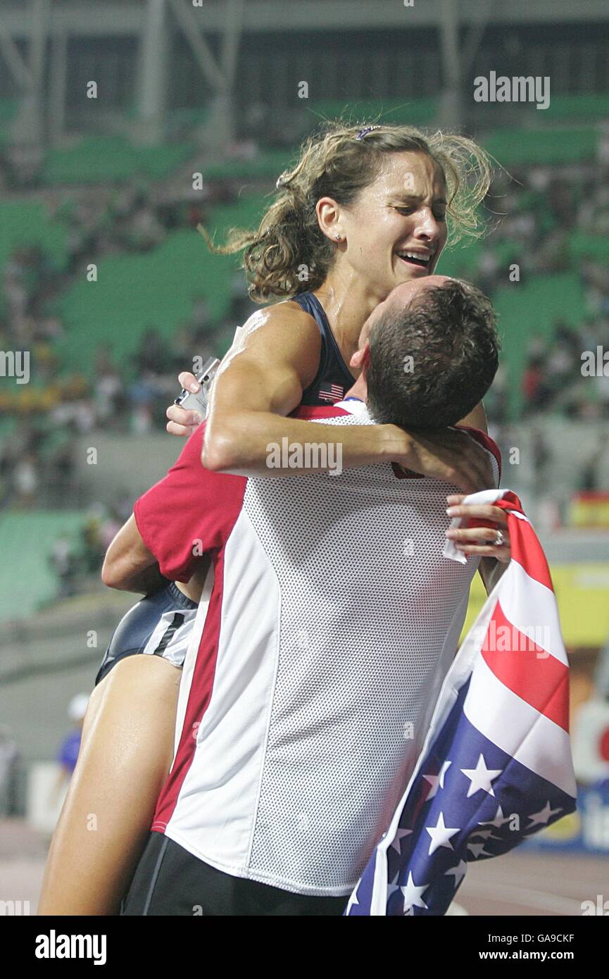 USA's Kara Goucher celebrates bronze with her husband Adam after ...