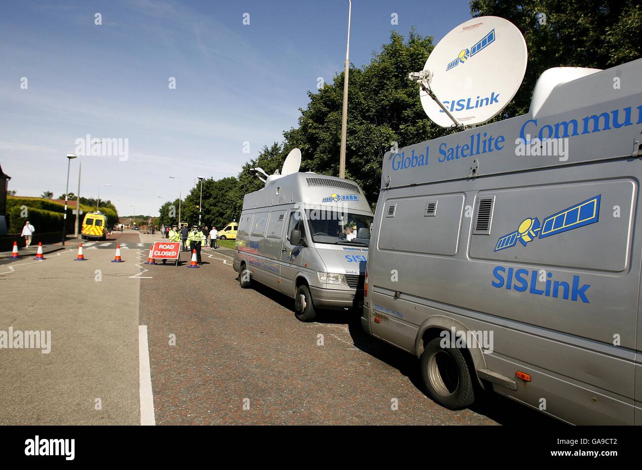 SIS vehicles near the scene of the muder of 11 year old Rhys Jones in Croxteth, Liverpool. Stock Photo
