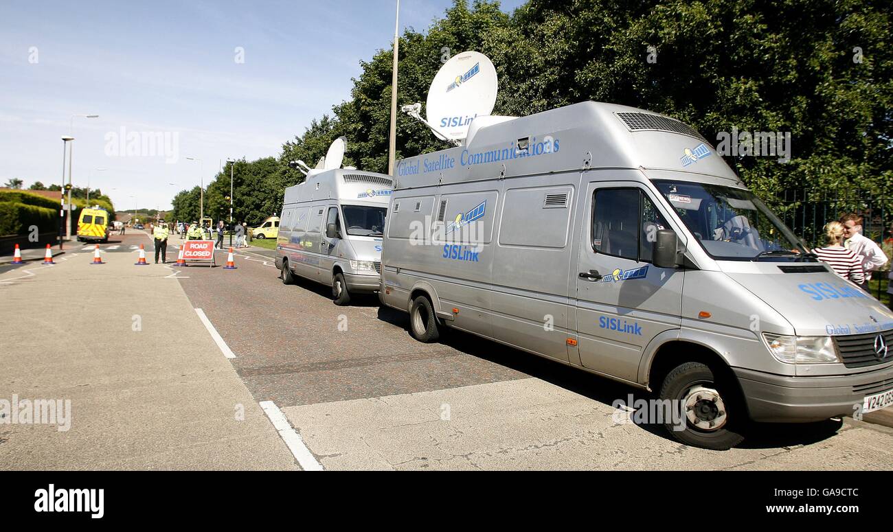 SIS vehicles near the scene of the muder of 11 year old Rhys Jones in Croxteth, Liverpool. Stock Photo