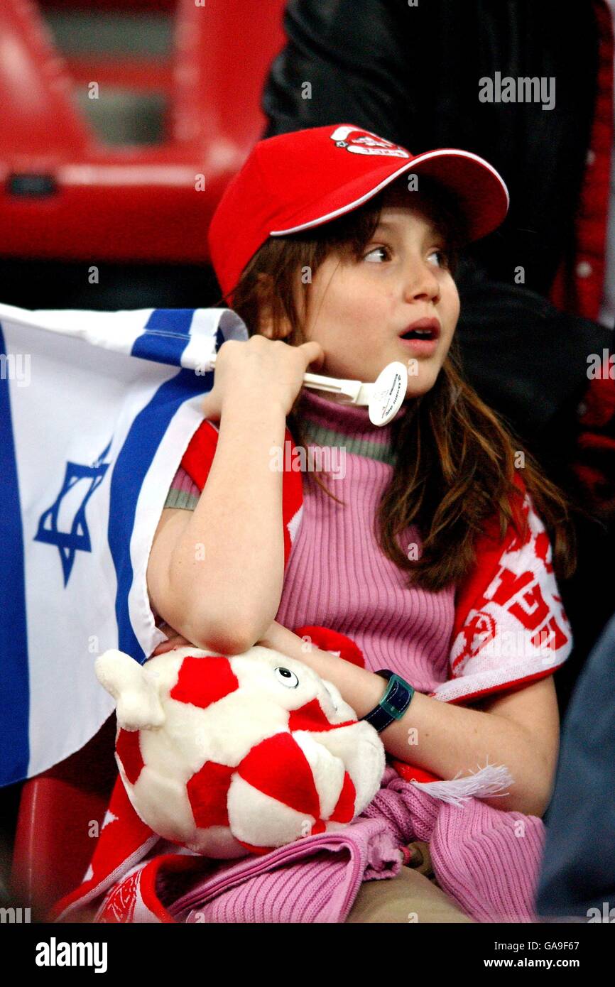 Soccer - UEFA Cup - Quarter Final - AC Milan v Hapoel Tel Aviv. A young Hapoel Tel Aviv fan with an Israel flag Stock Photo