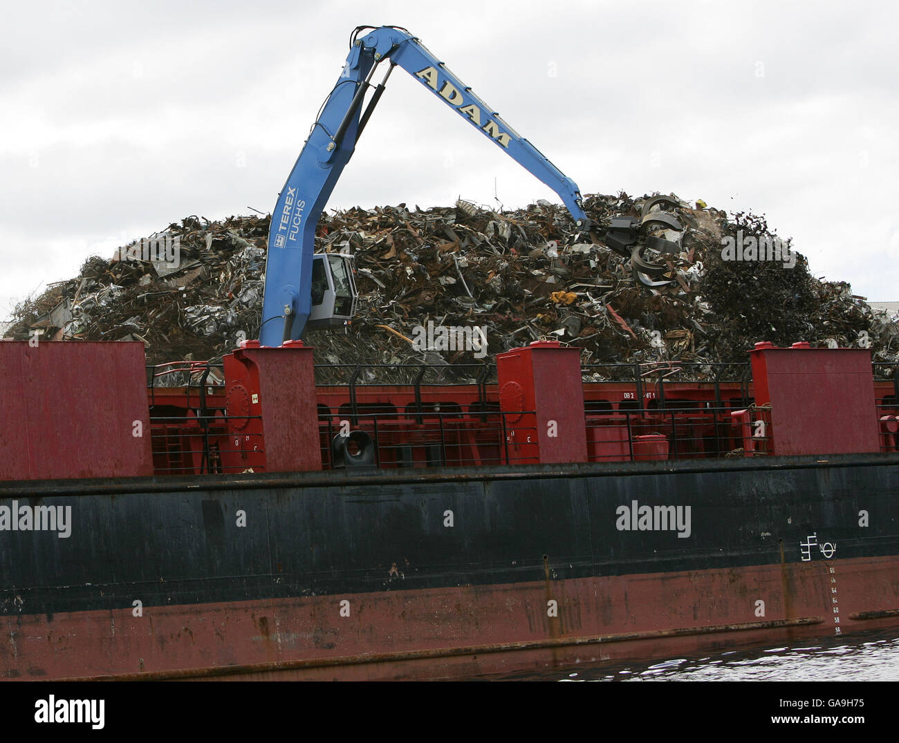 Scrap metal is loaded onto the cargo ship the Moksheim for recycling on