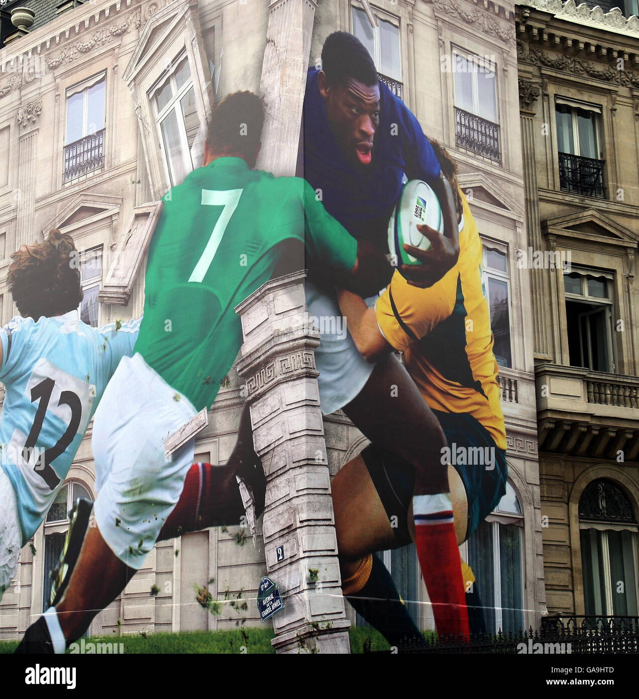 A building on the Avenue de la Grande Armee in Paris is covered in a mural of Serge Betson of France to promote the Rugby World Cup which starts in Paris tomorrow. Stock Photo