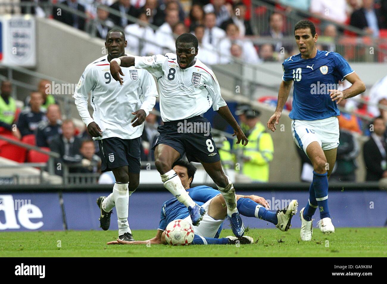 Soccer - UEFA European Championship 2008 Qualifying - Group E - England v Israel - Wembley Stadium. Israel's Idan Tal foul's England's Shaun Wright-Phillips as they battle for the ball Stock Photo