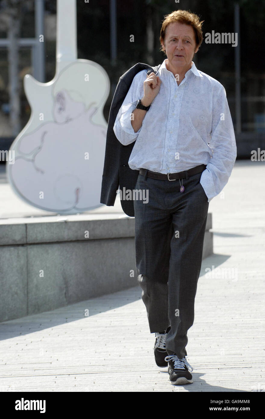 Sir Paul McCartney arrives to sign a 10ft high Les Paul Guitar sculpture in central London, painted by artist Rosie Brooks, which forms part of an exhibition at London's City Hall. Stock Photo