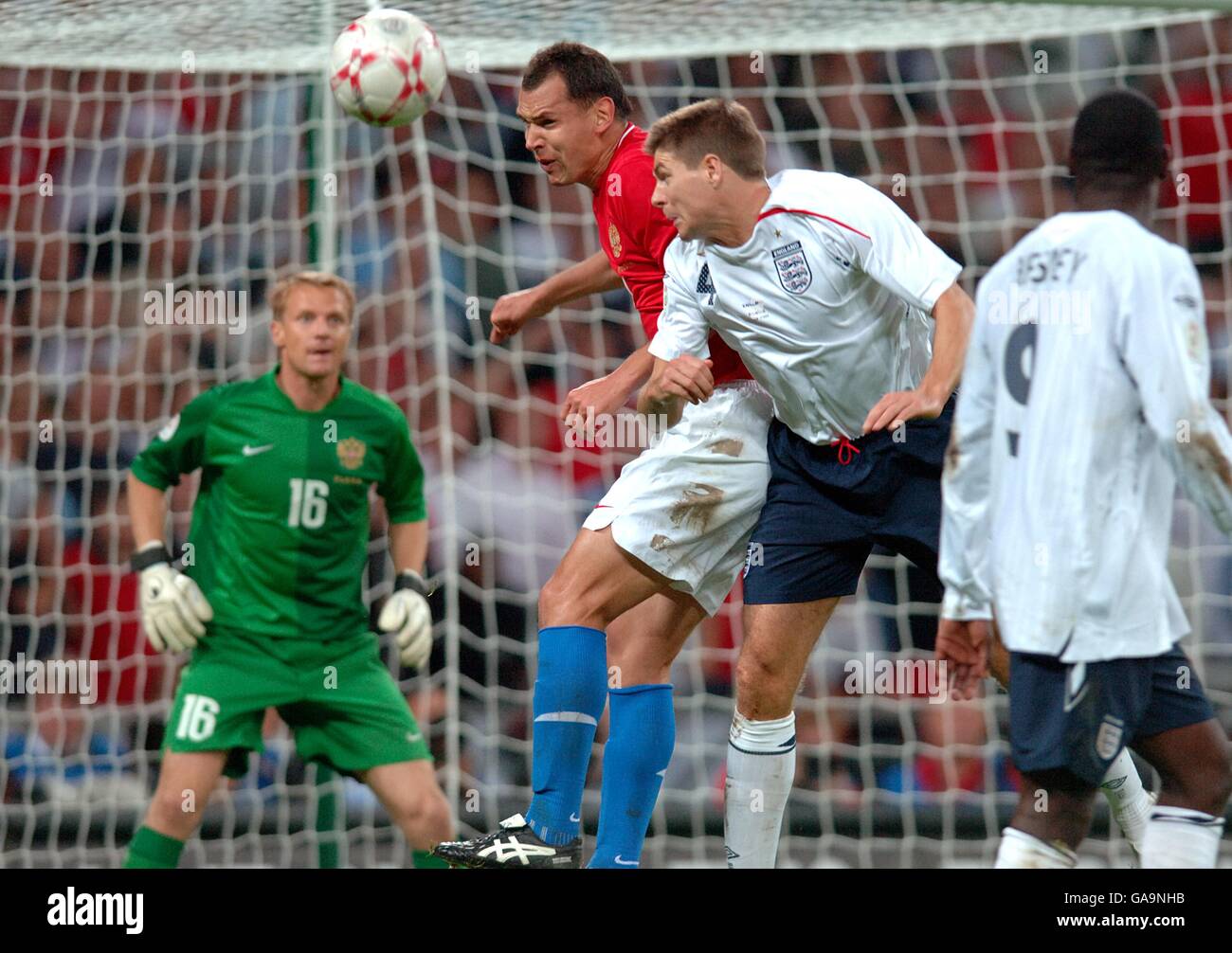 Soccer - UEFA European Championship 2008 Qualifying - Group E - England v Russia - Wembley Stadium. Russia's Sergei Ignashevich and England's Steven Gerrard jump for the header Stock Photo