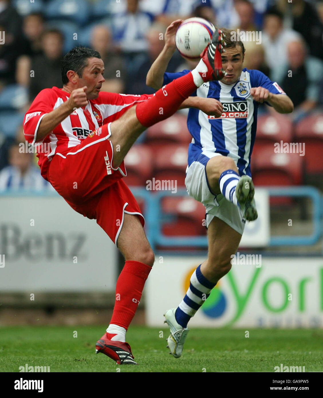 Huddersfield Town's Chris Brandon (right) and Cheltenham Town's Jeremy Gill during the Coca-Cola Football League One match at the Galpharm Stadium, Huddersfield. Stock Photo