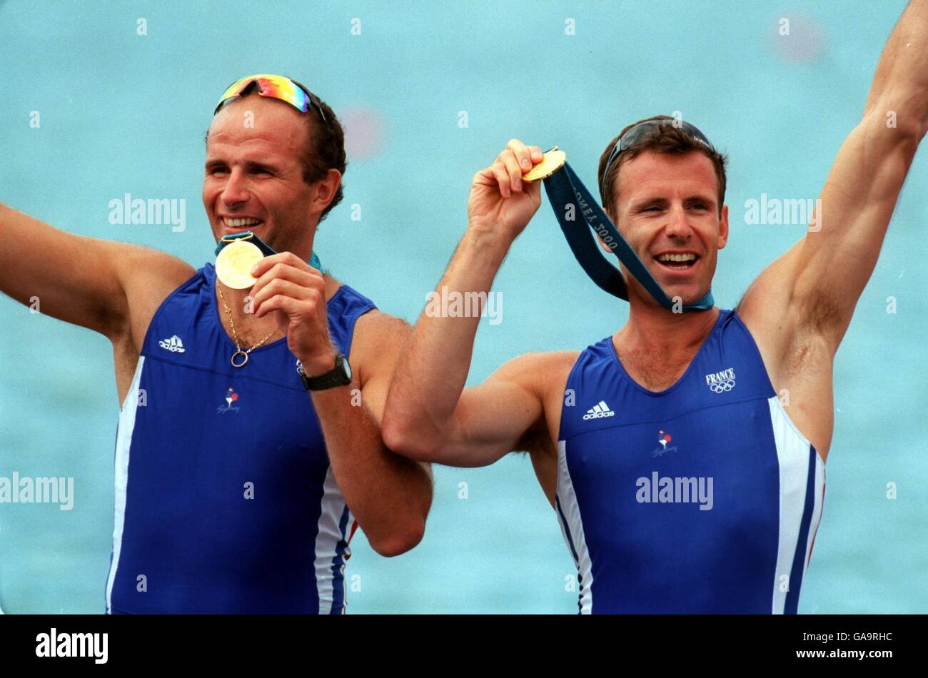 France's Coxless Pairs team of Michel Andrieux and Jean-Christophe Rolland  celebrate winning the gold medal Stock Photo - Alamy