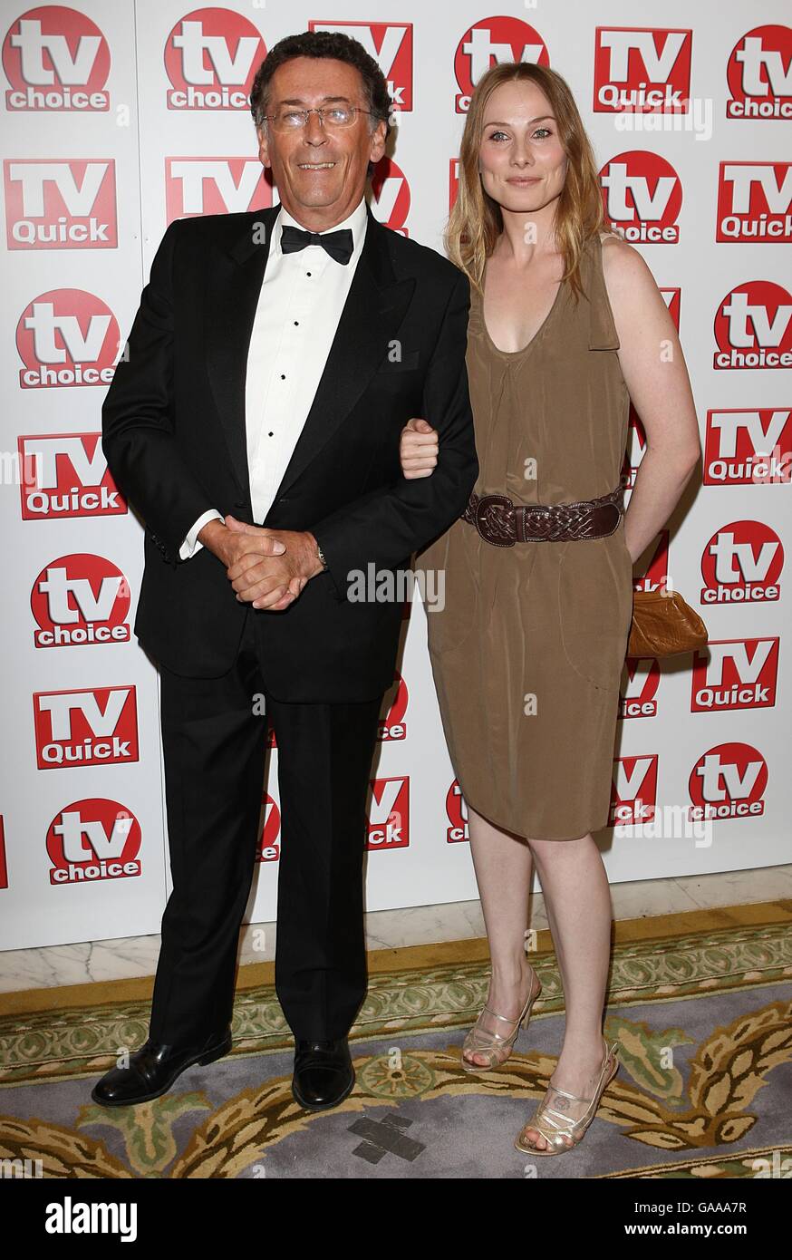 TV Quick and TV Choice Awards - Arrivals - London. Robert Powell and Rosie Marcel arriving for the TV Quick and TV Choice awards at The Dorchester, London. Stock Photo