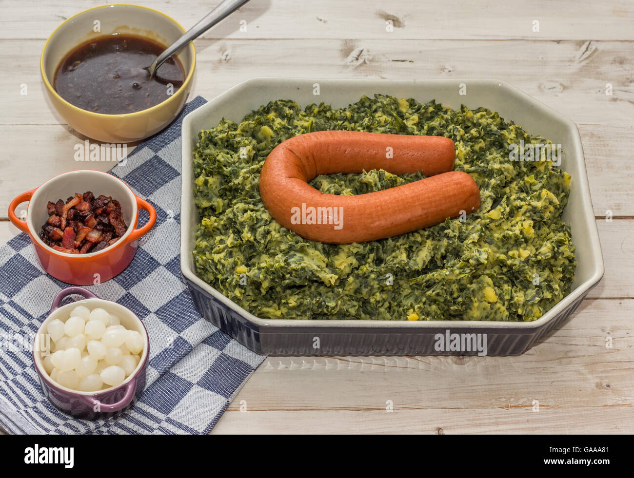 Typical dutch dish boerenkool with kale, mashed potatoes, smoked