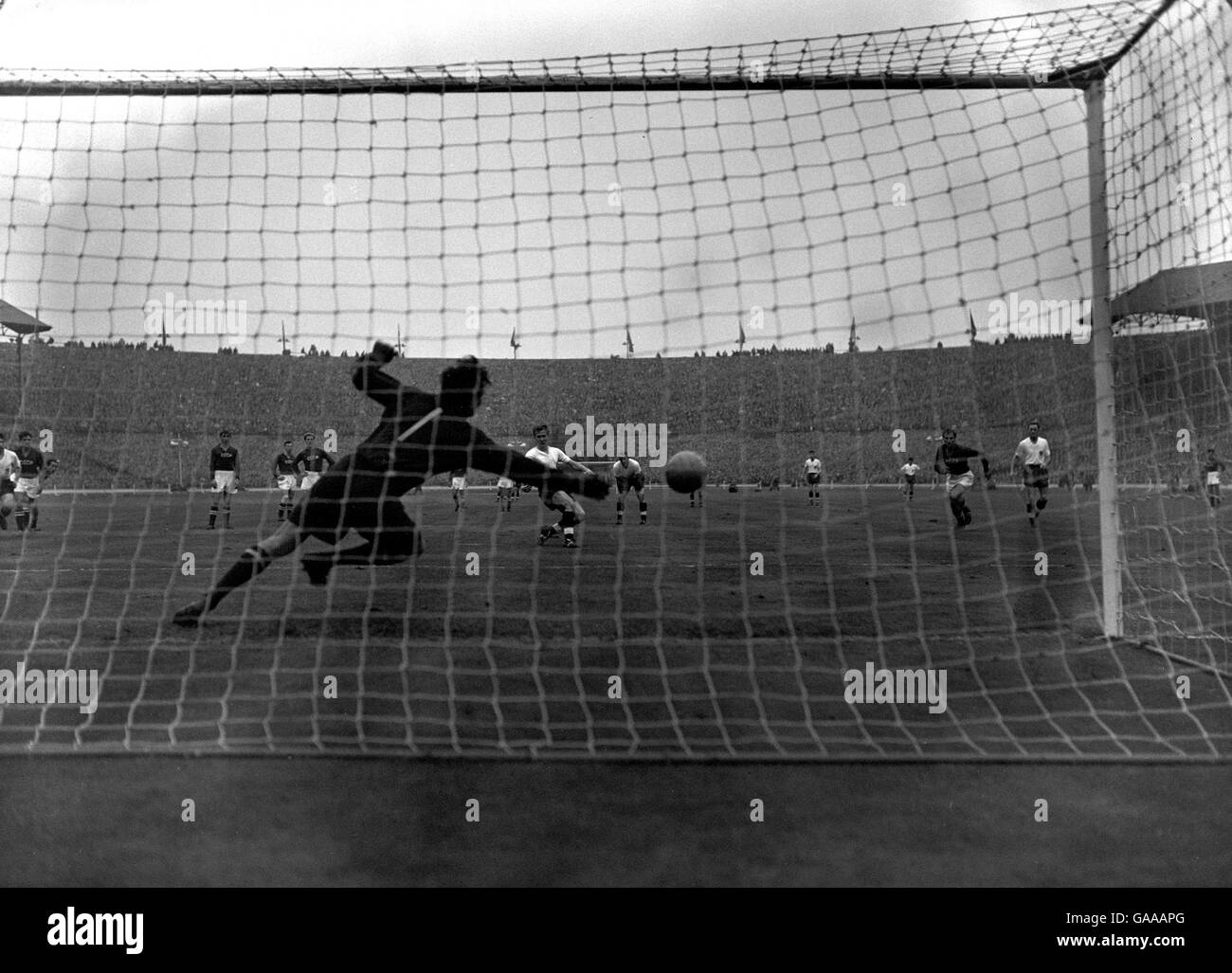 Soccer - Friendly - England v USSR. Bobby Charlton beats Russian goalkeeper Vladimir Belyayev with a penalty shot to give England another goal. Stock Photo