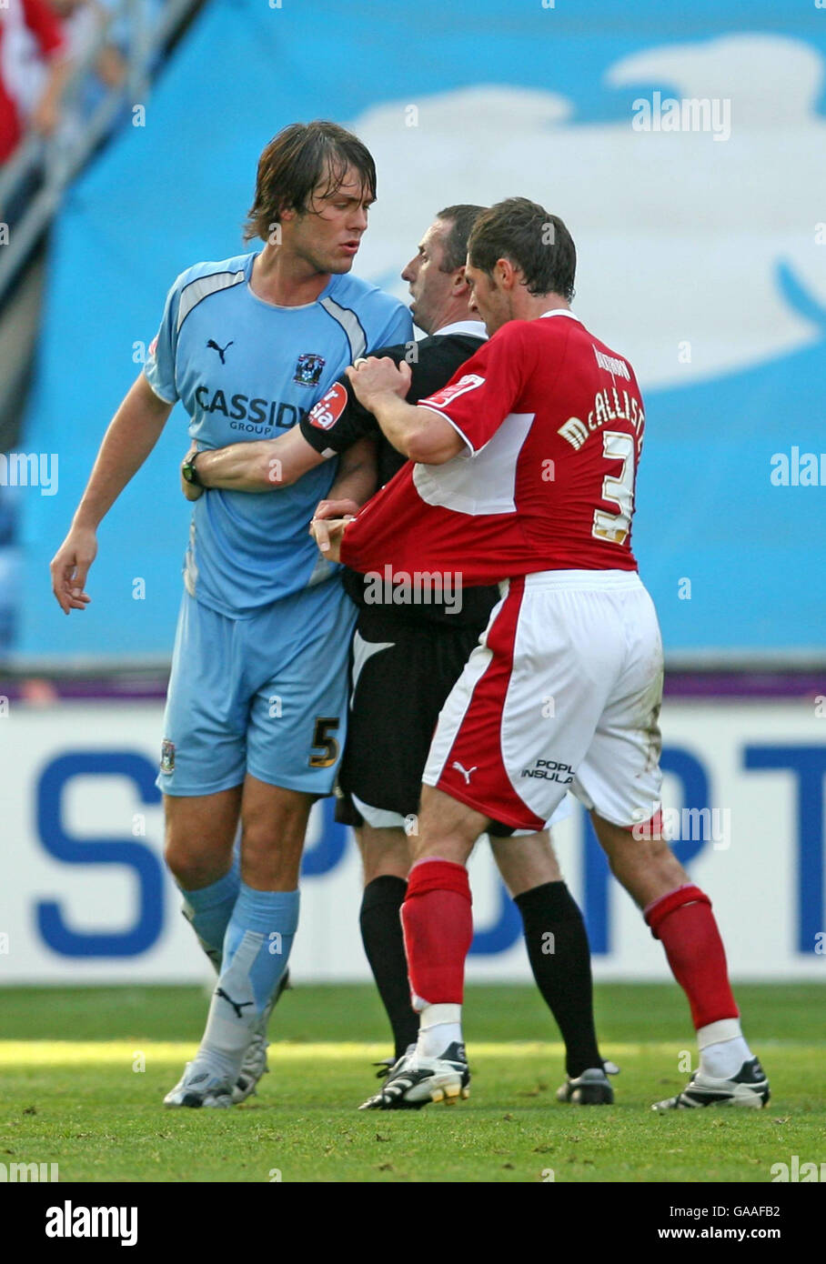 Coventry's Elliot Ward (left) clashes with Bristol City's Jamie McAllister, resulting in yellow cards for both players during the Coca-Cola Football Championship match at Ricoh Arena, Coventry. Stock Photo