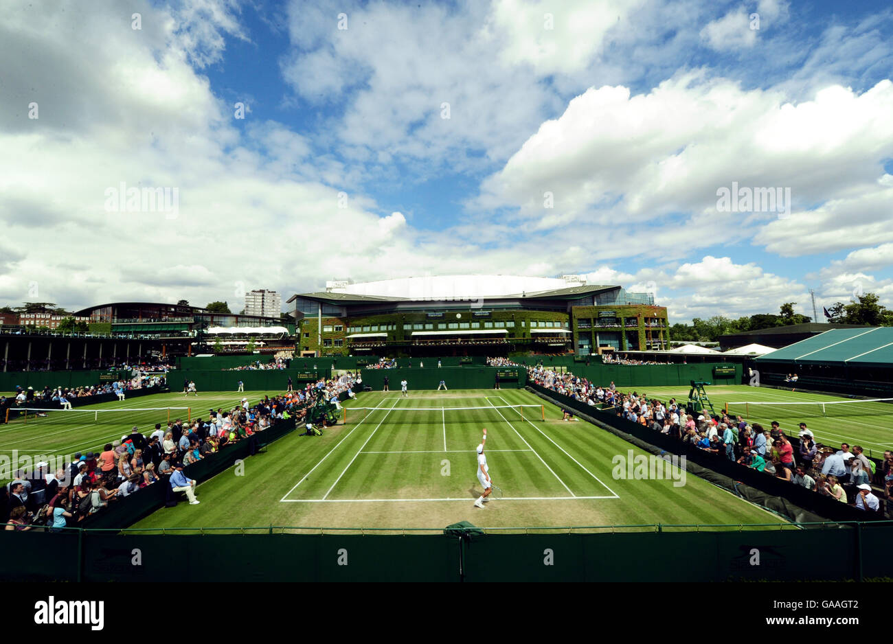 Ben Draper takes on Olukayode Alafia Damina on day seven of the Wimbledon Championships at the All England Lawn Tennis and Croquet Club, Wimbledon. Stock Photo