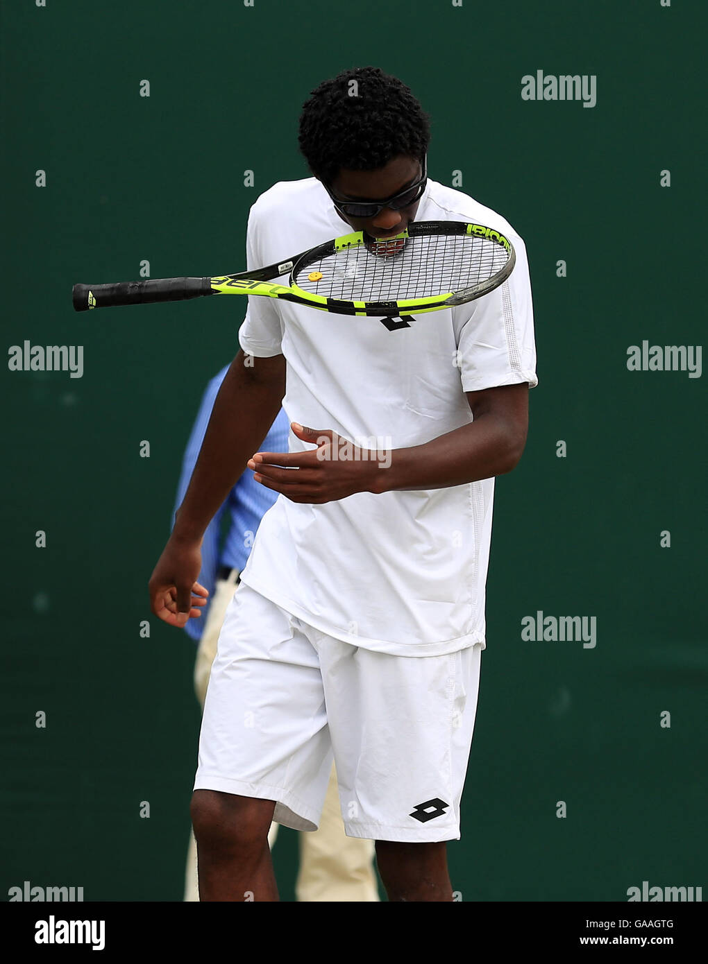 Olukayode Alafia Damina Ayeni in action in the boys singles on day seven of the Wimbledon Championships at the All England Lawn Tennis and Croquet Club, Wimbledon. Stock Photo