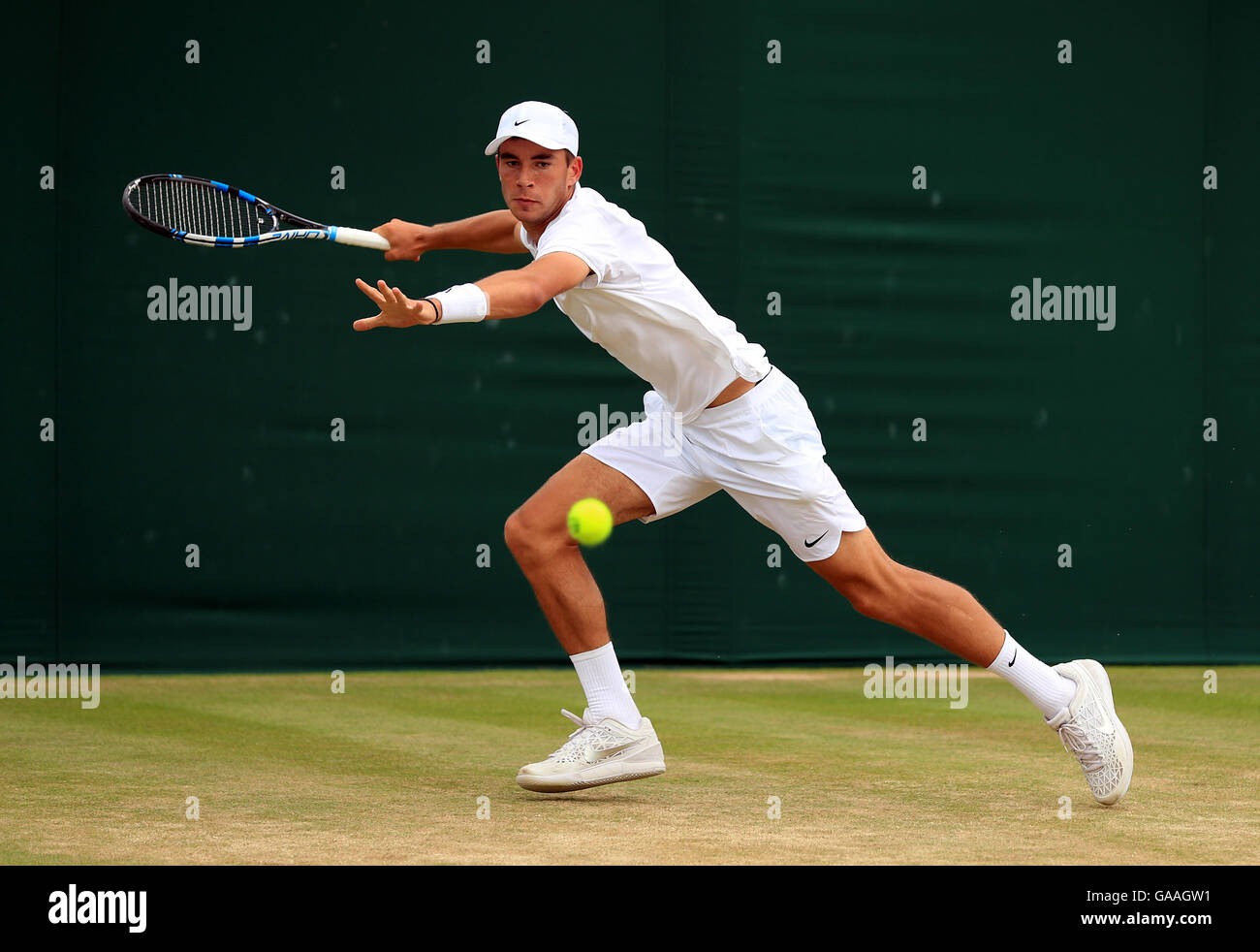 Ben Draper in action in the boys singles on day seven of the Wimbledon  Championships at the All England Lawn tennis and Croquet Club, Wimbledon  Stock Photo - Alamy