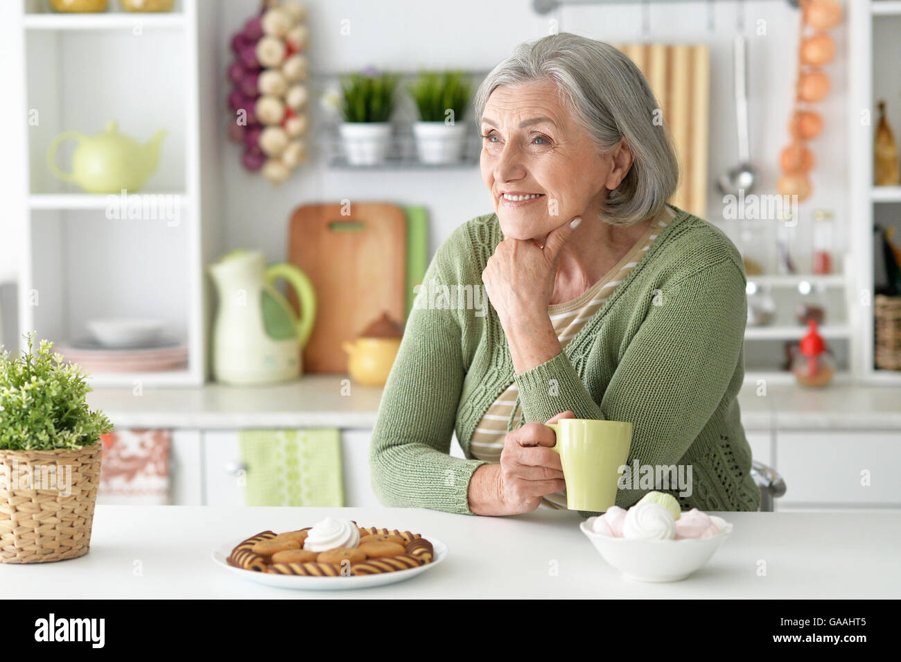 Mature grey haired woman and food hi-res stock photography and images ...