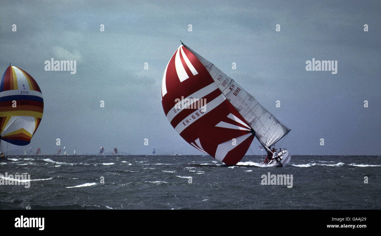 AJAXNETPHOTO. AUGUST, 1979. SOLENT, ENGLAND. - ADMIRAL'S CUPPER DEATH ROLL -  1 - HONG KONG ENTRY VANGUARD PERFORMS A CLASSIC BROACH AND WIPE OUT IN THE GALE FORCE WINDS THAT HIT THE FLEET DURING THE 2ND INSHORE RACE IN THE SOLENT. (THIS IS NR. 1 IN A SERIES OF 5 PICTURES; SEARCH ALAMY KEYWORD - VANGUARD). PHOTO:JONATHAN EASTLAND/AJAX  REF:906091 36 1 Stock Photo